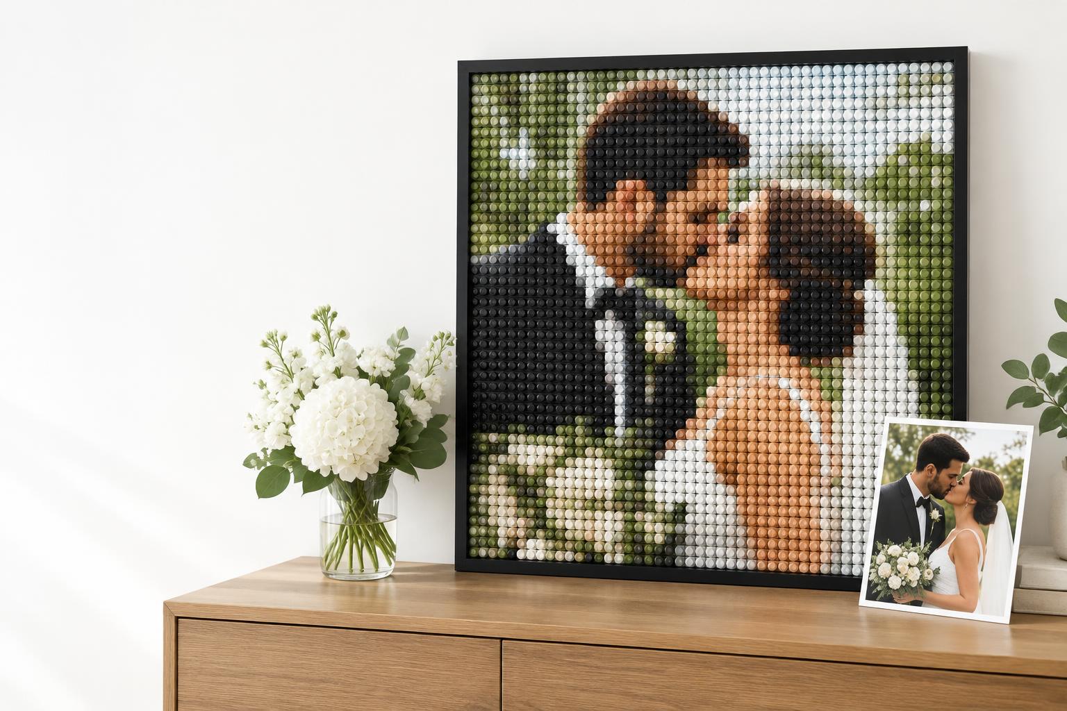 Wedding photograph beside a framed round-brick mosaic of the couple